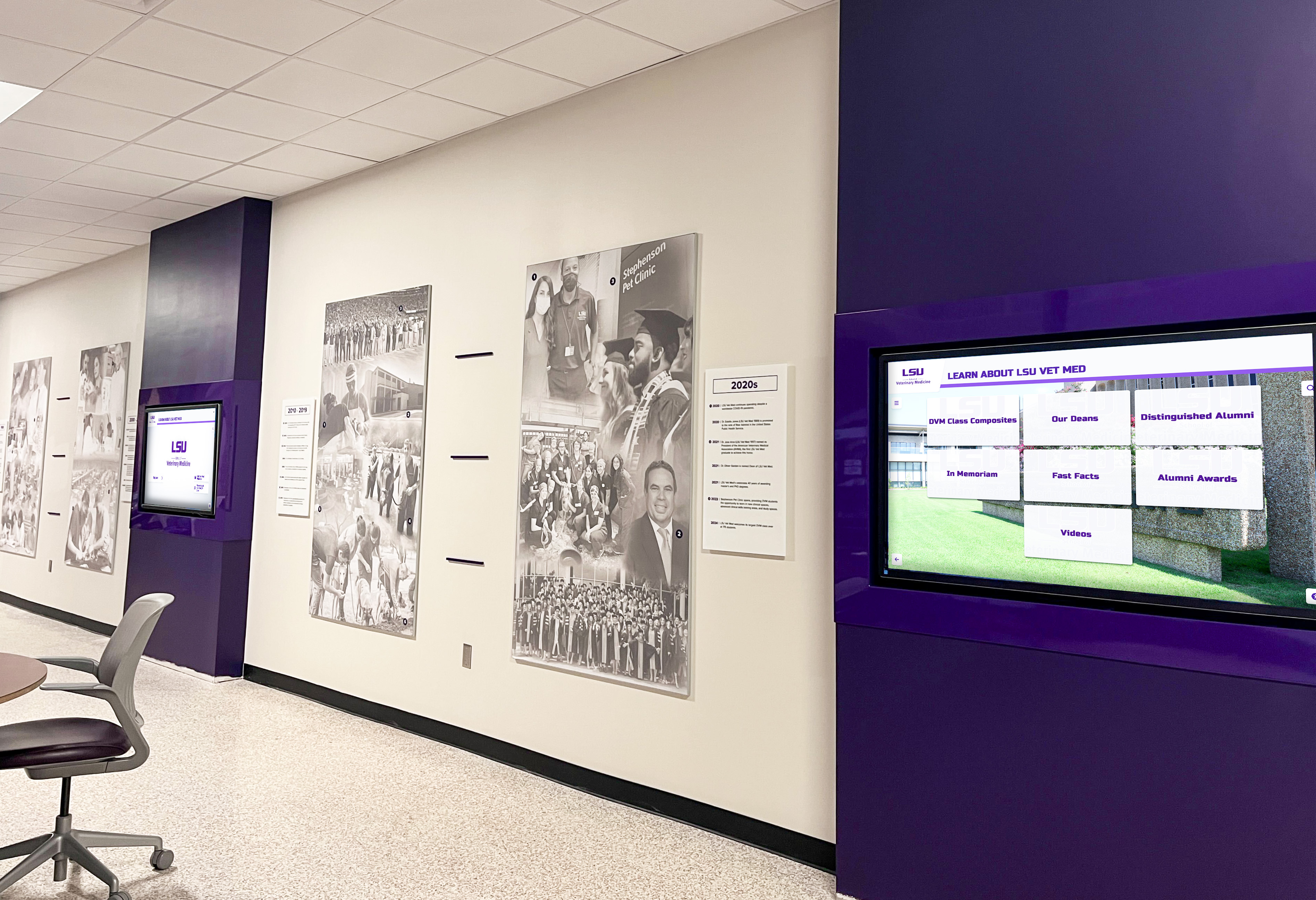 Multiple coordinated digital displays in institutional hallway Digital recognition display in athletic facility